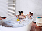 woman with daughter, bathroom,bathtube, retouching, Yucca